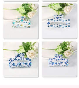 Detailed grid view of blue evil eye patterned hair claws with celestial star and moon elements