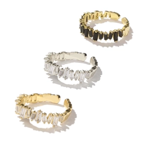 Detailed view of adjustable micro-set zircon rings in gold, silver, and black finishes