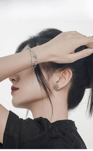 Detail of S925 sterling silver bamboo bracelet with green aventurine on female wrist