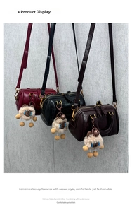 Detailed view of three mini Boston bags in burgundy, black and dark coffee with fur charms