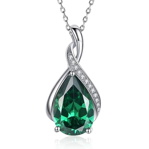 Detailed view of teardrop pendant with emerald green stone and silver cubic zirconia frame