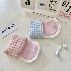 Detailed view of plaid lace cases for AirPods with button closure in pink and blue