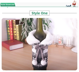 Knitted reindeer wine bottle cover with white faux fur collar and pompom details