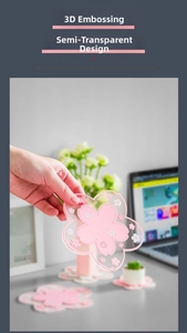 Macro detail of 3D embossed pink cherry blossom coaster with translucent texture
