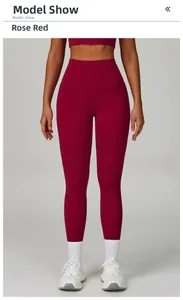 Detailed view of high-waisted rose red yoga pants and matching sports bra on model