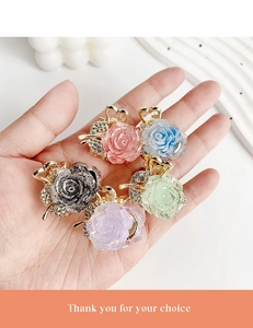 Detailed set of five glitter resin flower mini hair claws with rhinestones and gold base