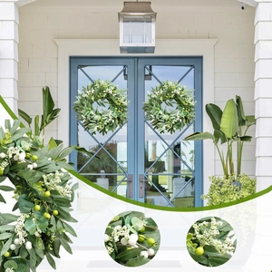 Artificial olive leaf and berry wreath for front door home decor on light blue background