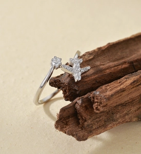 Macro detail of S925 sterling silver airplane ring with sparkling zircon inlays