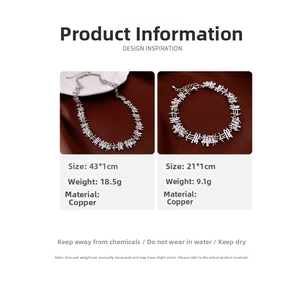Detail view of silver necklace and bracelet set with rectangular zircon stones on velvet