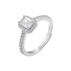 Macro view of adjustable silver-tone ring with rectangular zircon and pave setting detail