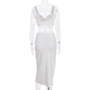 Back view of a white two-piece crop top and maxi skirt set on a mannequin