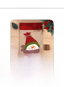 Detail of Christmas snowman burlap gift bags in large and small sizes with drawstring