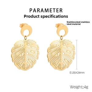 Detail of 18K gold plated stainless steel monstera leaf earrings with dimensions