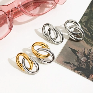 Boucles d'oreilles ovales bicolores en acier inoxydable au fini or et argent chic