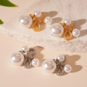 Elegant bow-shaped pearl stud earrings in gold and silver plating on stone base