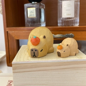 Handcrafted wooden Capybara figurines with orange accents for home and desktop decor