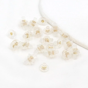 Transparent silicone earring backs with 18K gold plated metal cores on white background