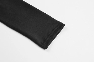 Detailed close-up of double-stitched hem on high-neck black bodycon dress fabric