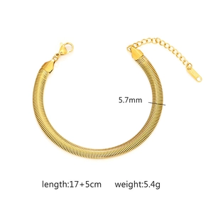 Detail view of 5.7mm golden wheat chain bracelet with S.STEEL engraved lobster clasp