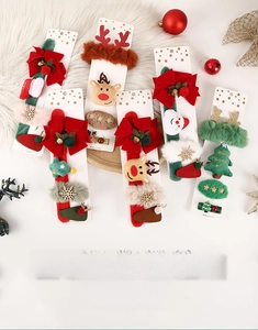 Detail of Christmas snap bracelets set with reindeer, Santa Claus, and tree motifs