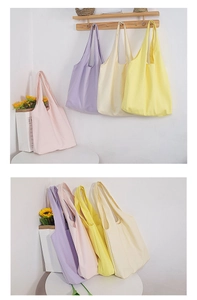 Detail showing macaron color canvas tote bags in purple, white, yellow, and pink