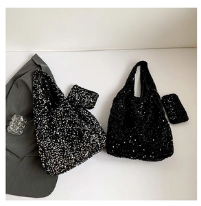 Detail of sequin tote bag with matching coin purse in black and silver-black finish