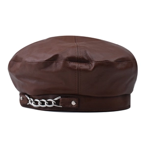 Close-up of brown PU leather beret featuring a chunky silver chain and rivet detail