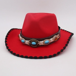 Close-up of red felt jazz hat with ethnic beaded leather band and black stitched edge