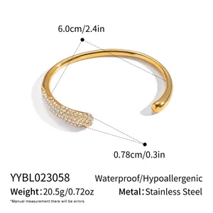Detailed view of 18K gold plated stainless steel open bangle with crystal pavé and 6.0cm diameter