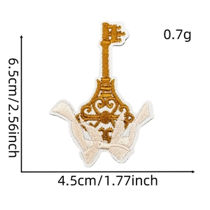 Detailed view of gold and beige key-shaped embroidery patch with precise size measurements