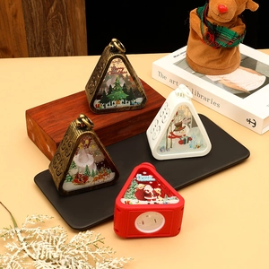 Detail of vintage Christmas lanterns with Santa Claus prints and warm LED light