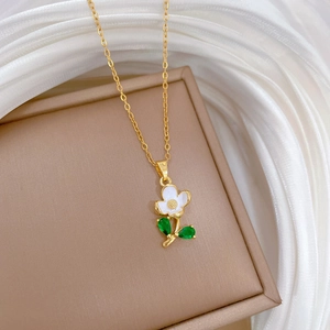 Elegant gold flower necklace with green leaf crystals and white petals for women