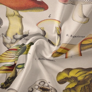 Detailed close-up of vintage mushroom botanical print on beige cotton fabric