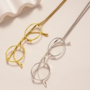 Chic long necklace with creative gold and silver metal glasses pendant in minimalist style