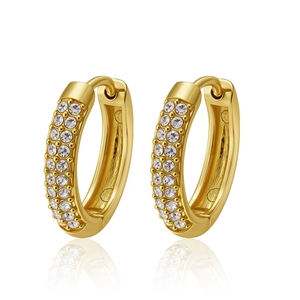 Macro shot of gold-plated hoop earrings with three rows of sparkling white zircon stones