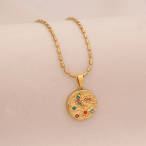 Gold stainless steel necklace with round celestial pendant featuring colorful crystals