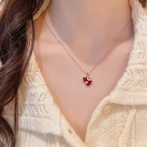Elegant gold necklace with double heart pendant in red enamel and zircon for women