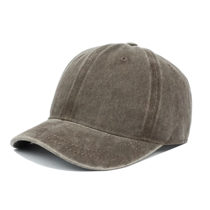 Detail view of washed cotton canvas fabric on brown short brim retro baseball cap