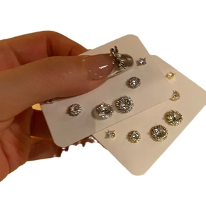 Set of round cubic zirconia stud earrings in various sizes with silver plating