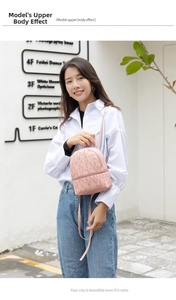 Detailed view of pink PU leather mini backpack featuring Lucky Girl letter print texture