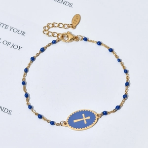 Gold stainless steel cross bracelet with blue enamel beads and central oval pendant