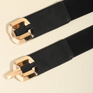 Women's black elastic waist belt with a polished golden C-buckle and lychee leather detail
