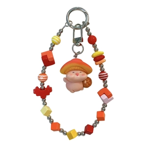 Vibrant dopamine style beaded phone chain with a cute pink pig in mushroom hat charm