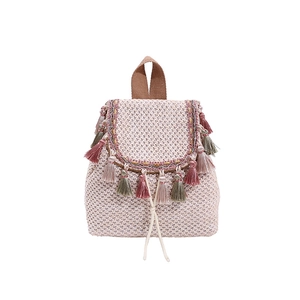 Pink woven straw bucket bag with colorful tassels and drawstring for summer beach outings