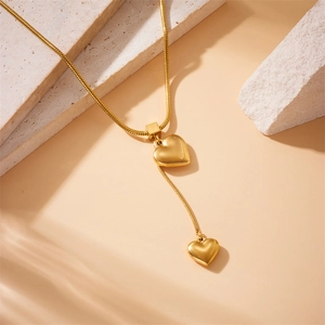 Minimalist gold plated stainless steel Y-necklace with elegant double heart pendants