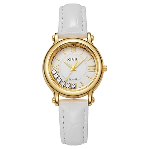 Elegant gold quartz watch with white leather strap and floating rhinestones on dial