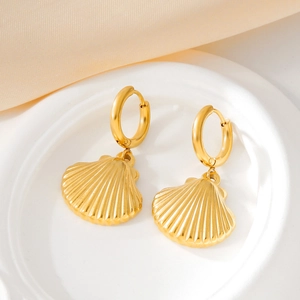Gold shell pendant hoop earrings with realistic texture for a summer ocean look