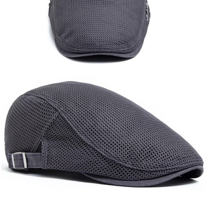 Detail of dark grey breathable mesh fabric and adjustable metal buckle on summer flat cap