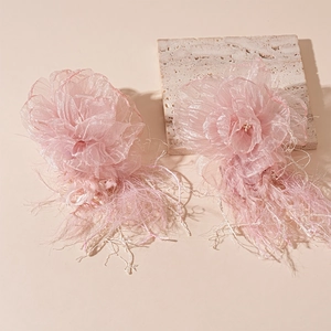 Pink handmade lace flower earrings with soft feathers and tassels in a summer vacation style