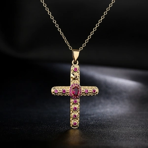 Religious 18K gold-plated cross necklace with pink zircon on black silk background